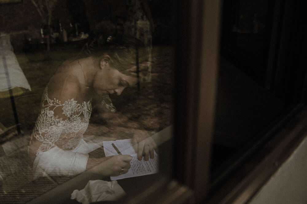 Bride writing wedding vows, destination wedding in Tuscany