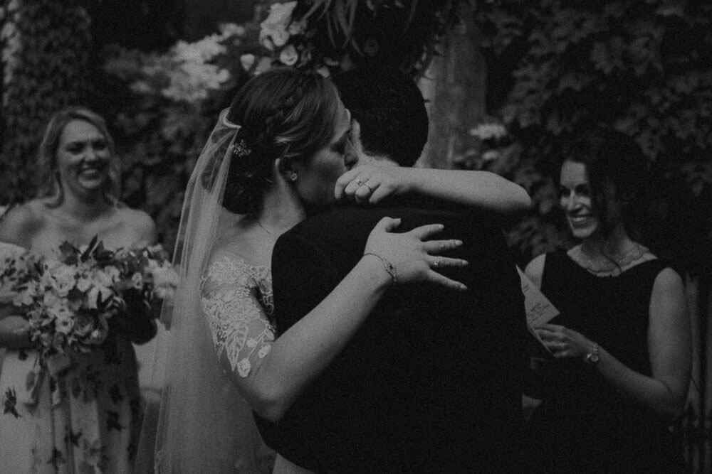 newlyweds embrace after marriage