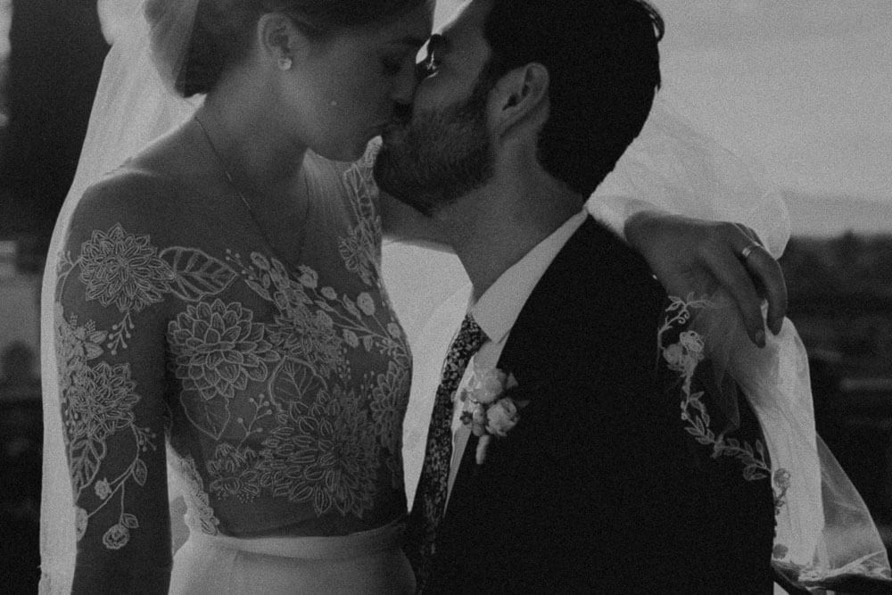 emotional kiss between bride and groom, artistic wedding photographer tuscany
