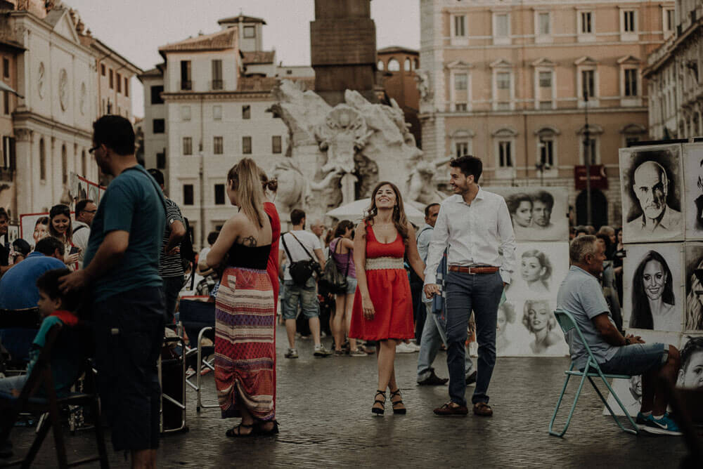 couple in love walking in piazza navona, rome couple photographer