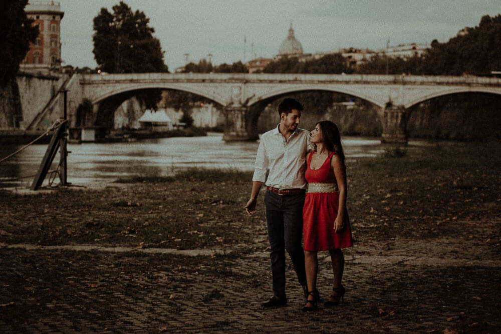 sunset walk on tevere river for an engaged couple, engagement photography in rome