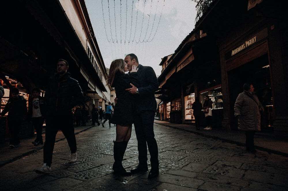 Christmas couple portrait on Ponte Vecchio in Florence, Tuscany