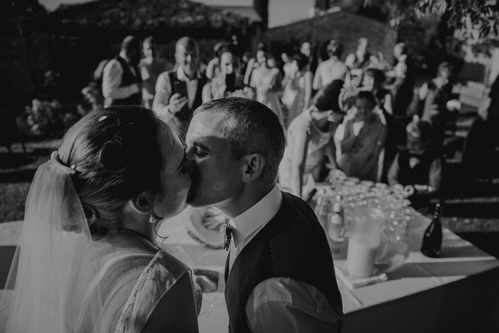 destination irish wedding ceremony in tuscany: bride and groom kiss