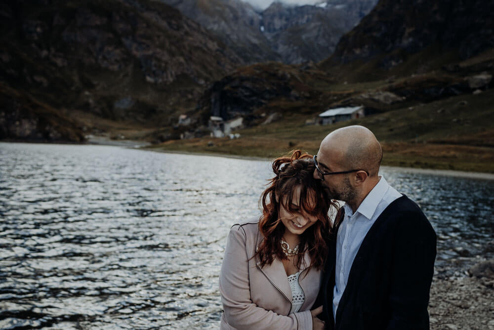 couple cuddling, elopement session on alps