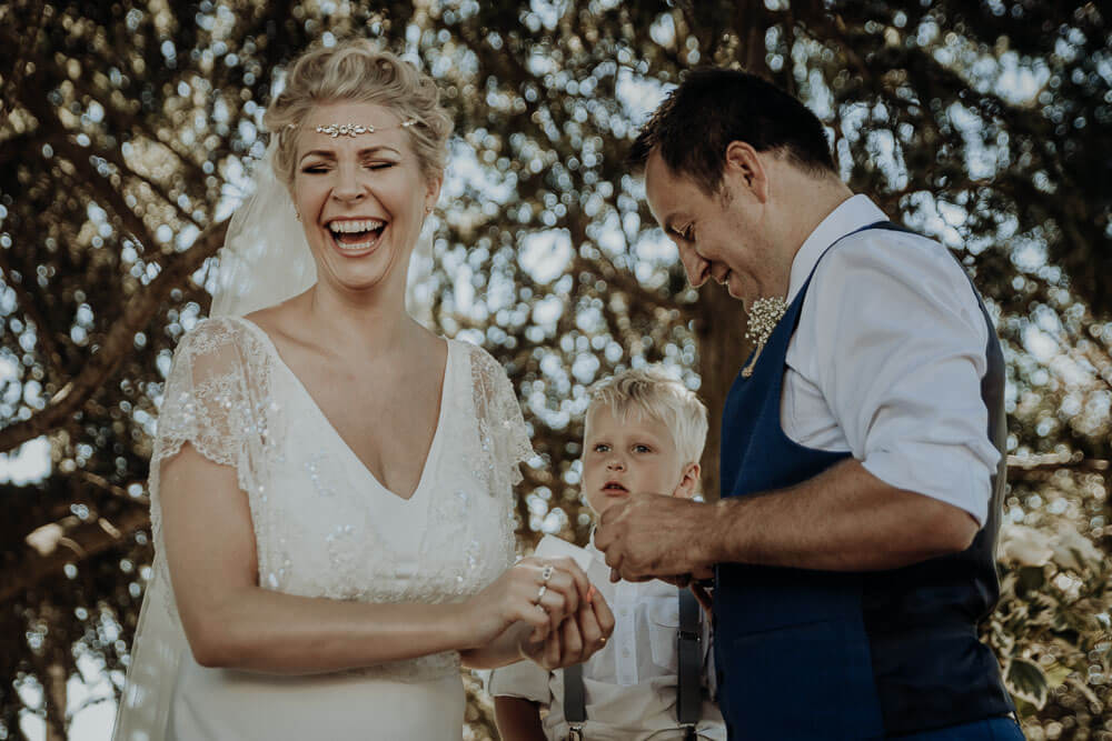 bride and groom ring exchange, langhe piedmont wedding photographer