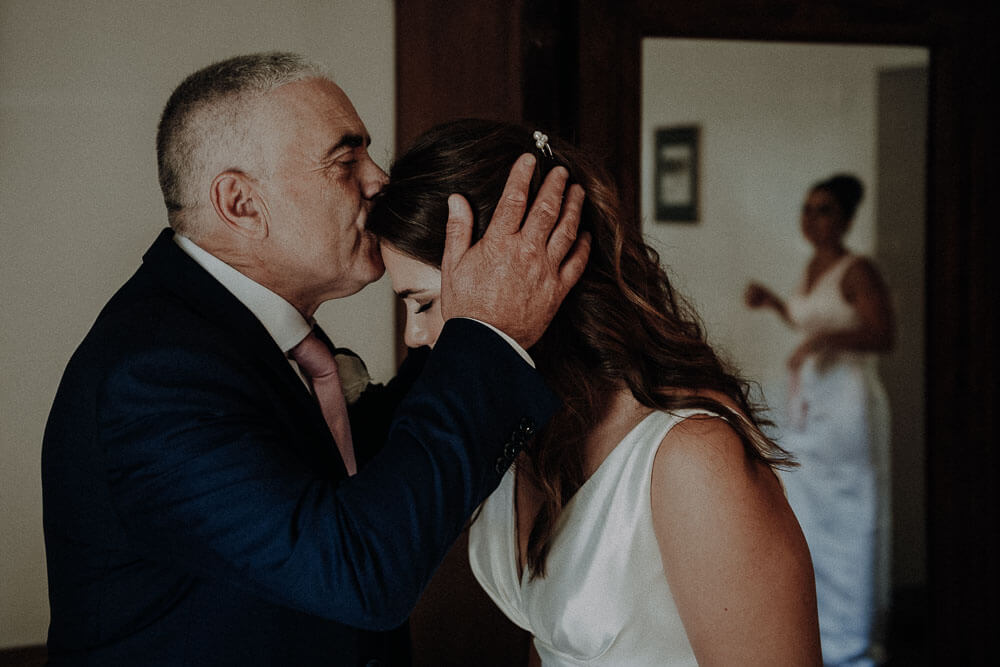 bride and her father kissing, tuscany wedding in cortona