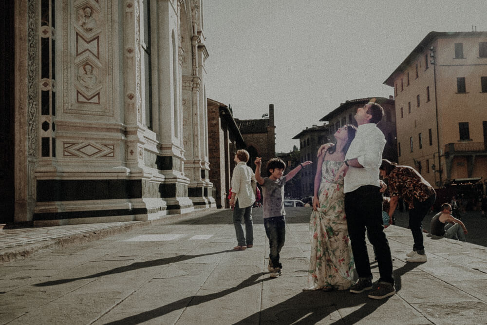 romantic couple walk in the street of florence